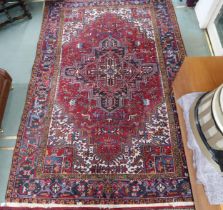 *WITHDRAWN* A red geometric patterned ground Belouch rug with dark blue and white geometric central