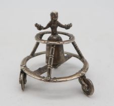 A Dutch silver miniature toy, by Arnoldus Van Geffen, modelled as a figure walking within a