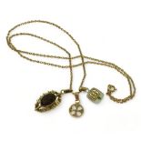 A 9ct gold smoky quartz retro pendant, an Ola Gorie 9ct Celtic cross pendant, a 10k emerald