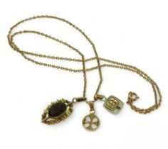 A 9ct gold smoky quartz retro pendant, an Ola Gorie 9ct Celtic cross pendant, a 10k emerald