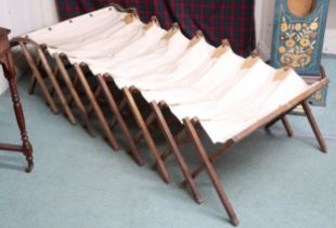 A 20th century oak framed Junuetta folding campaign bed, 171cm long x 75cm wide x 41cm high