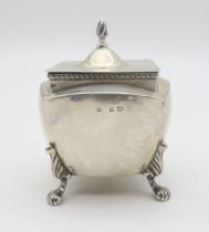 An Edwardian silver tea caddy, by William Devenport, Birmingham 1905, of shaped square form, on four