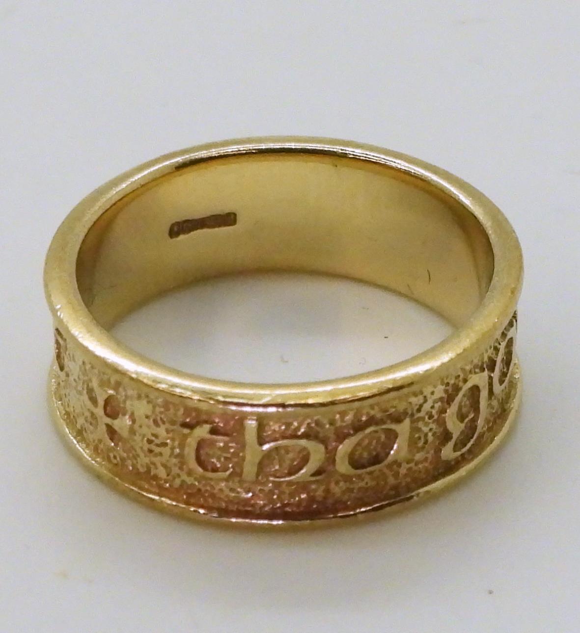 A 9ct gold ring with embossed Celtic phrase 'Tha gaol agam ort' - I Love you, made by Ola Gorie, - Image 3 of 3