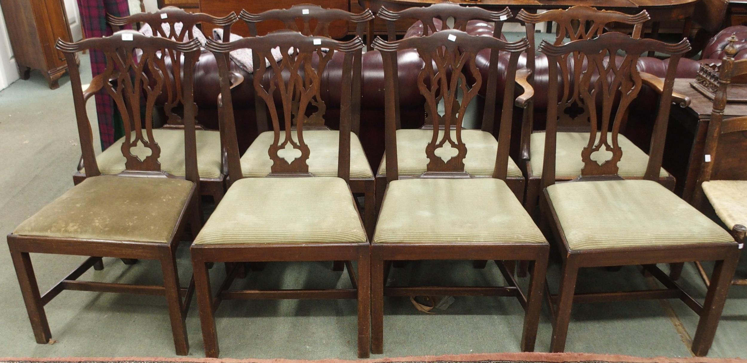 A set of eight 19th century mahogany dining chairs with scrolled fretwork splats on square