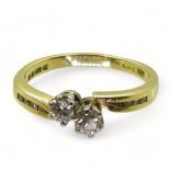 An 18ct gold twin stone diamond ring, set with estimated approx 0.30cts of brilliant cut diamonds,