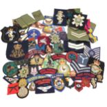 Assorted military cloth patches, with a number of bullion-embroidered examples, including the