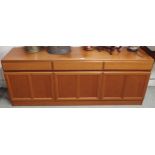 A mid 20th century teak sideboard with three drawers over three cabinet doors, 69cm high x 181cm