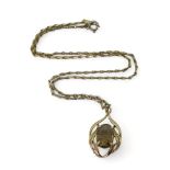 A 9ct gold smoky quartz pendant with a gold plated Monet chain, weight of the pendant approx 3.