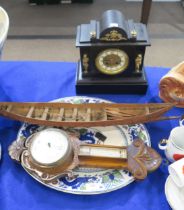A slate mantle clock with ormolu mounts, a wooden barometer, a ceramic platter and a wooden model of