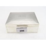 A Goerge V silver cigarette box, by William Hair Haseler, Birmingham 1933, the lid with engine-