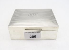 A Goerge V silver cigarette box, by William Hair Haseler, Birmingham 1933, the lid with engine-