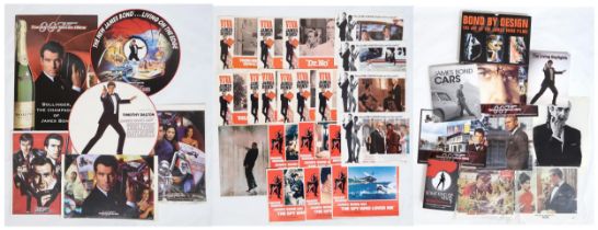 JAMES BOND A collection of prints, books and magazines on Bond, to include two circular carboard