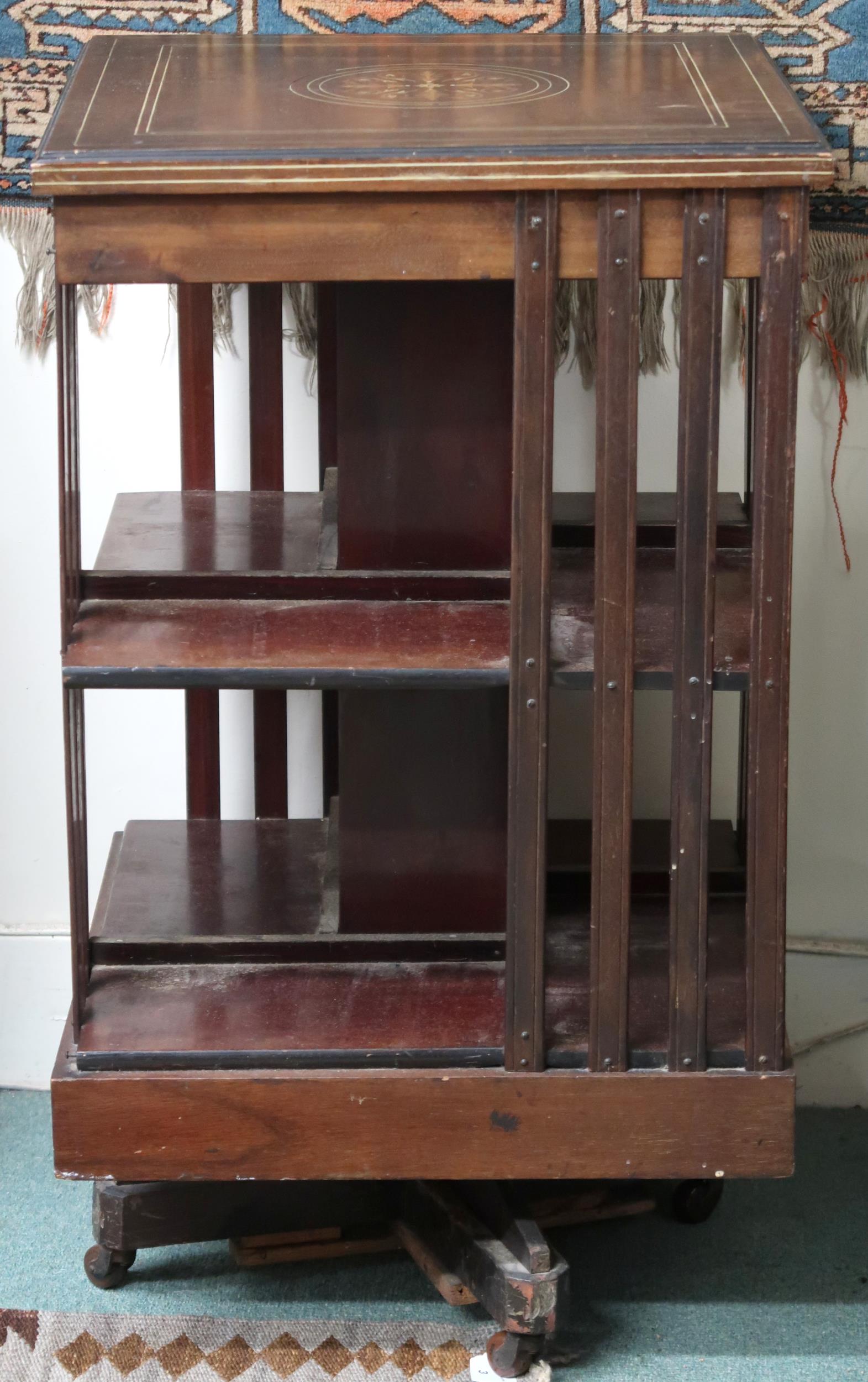 An Edwardian mahogany revolving bookcase, 88cm high x 51cm wide x 51cm deep Condition Report: