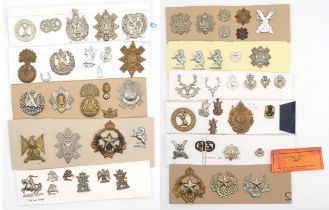 A large collection of military cap and other badges, to include the Lovat Scouts, Fife and Forfar