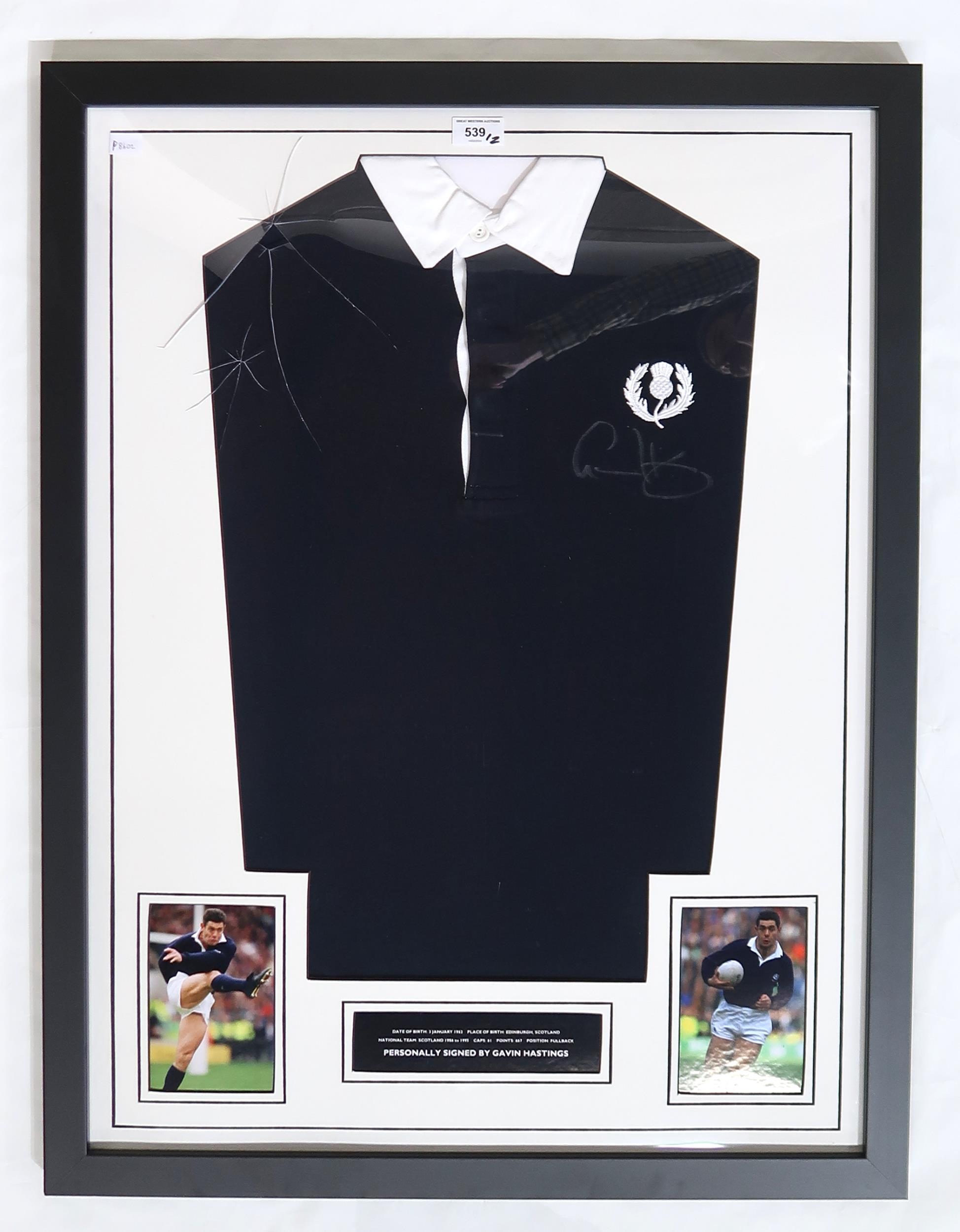 A Scotland rugby shirt signed by fullback Gavin Hastings, framed under Perspex (def), measuring