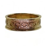 A 9ct gold ring with embossed Celtic phrase 'Tha gaol agam ort' - I Love you, made by Ola Gorie,