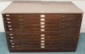 A 20th century pitch pine plan chest with painted top over ten narrow folio drawers on plinth