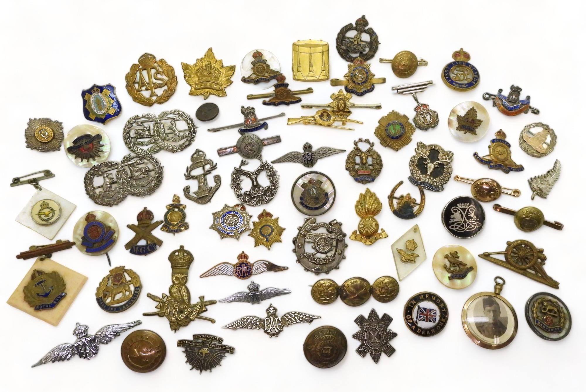 A collection of sweetheart brooches and other items to include A silver Gordon Highlanders brooch,