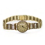 A 9ct gold ladies record De Luxe watch and strap, length 18.5cm, diameter approx 2cm, weight