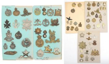 An album of mixed military cap badges, to include the RAF/RFC, Intelligence Corps, East Lancashire