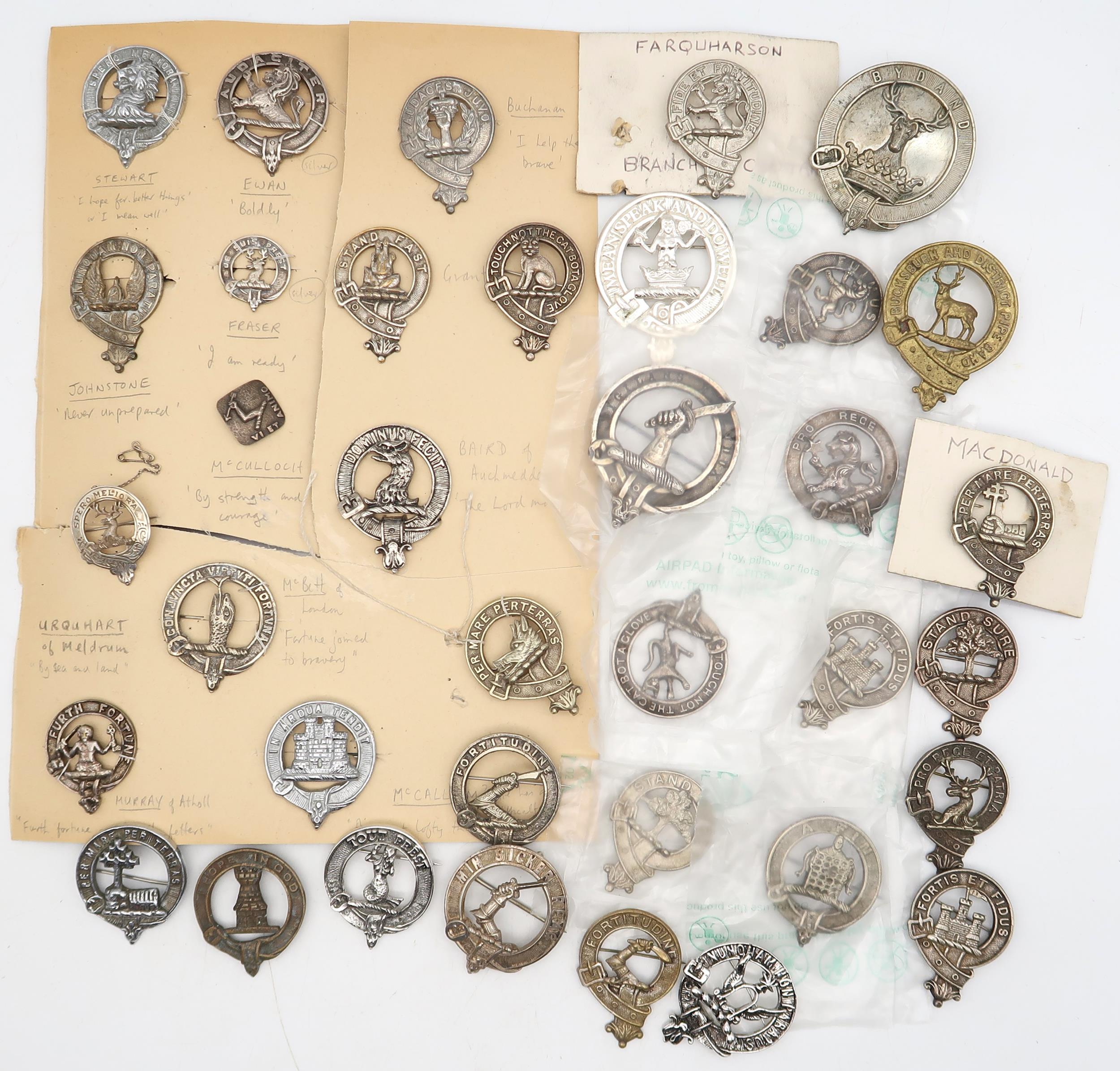 A collection of Scottish clan badges, to include an Edinburgh silver Moffat example; others