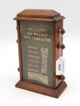 An early-20th century perpetual desk calendar, with printed face listing postal rates, measuring