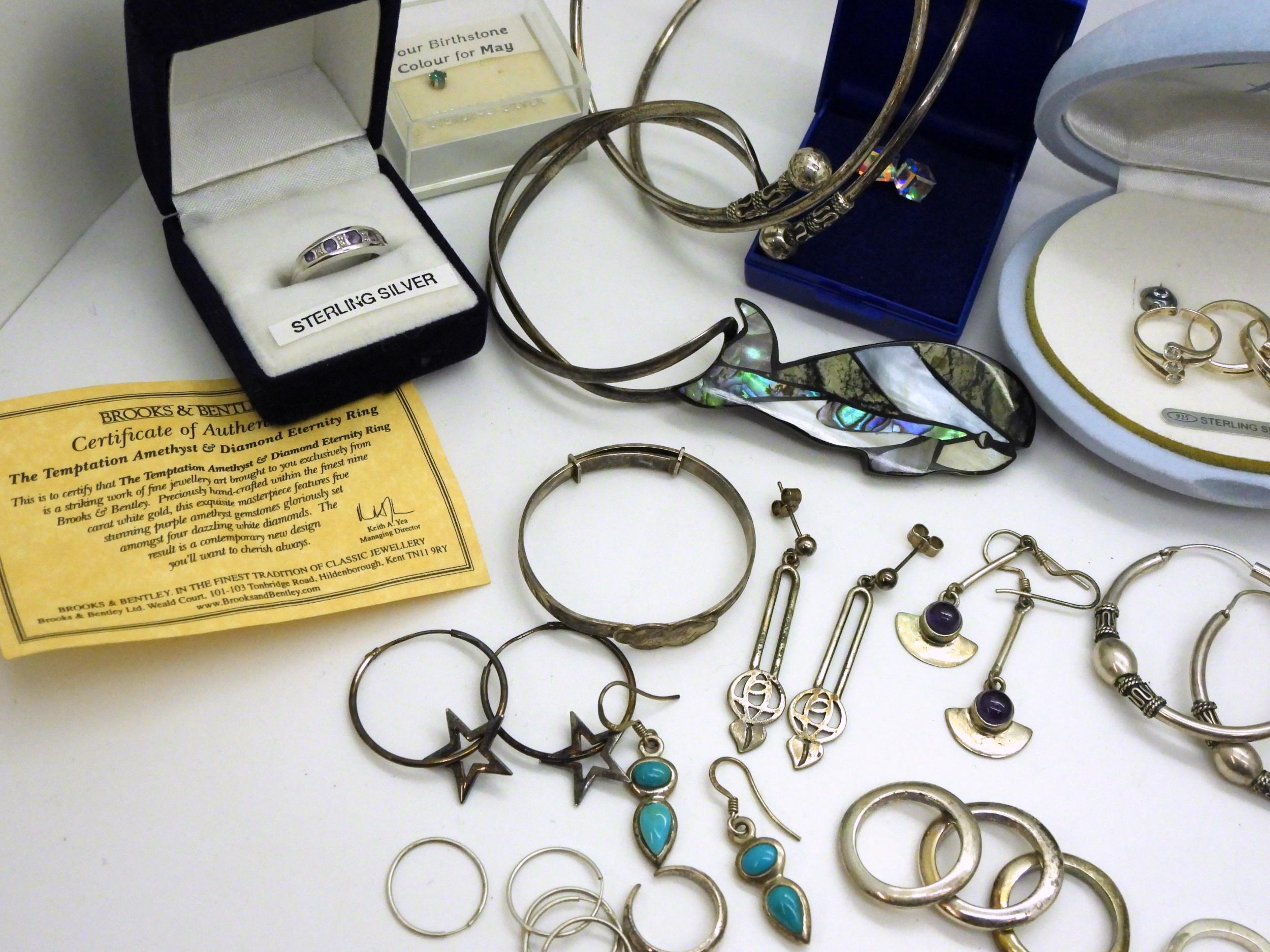 A collection of silver and white metal jewellery to include A spiral link bracelet, a Brooks & - Image 3 of 3