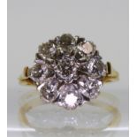 An 18ct gold and diamond cluster ring set with estimated approx 1.35cts of brilliant cut diamonds,