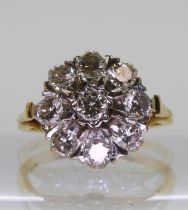 An 18ct gold and diamond cluster ring set with estimated approx 1.35cts of brilliant cut diamonds,