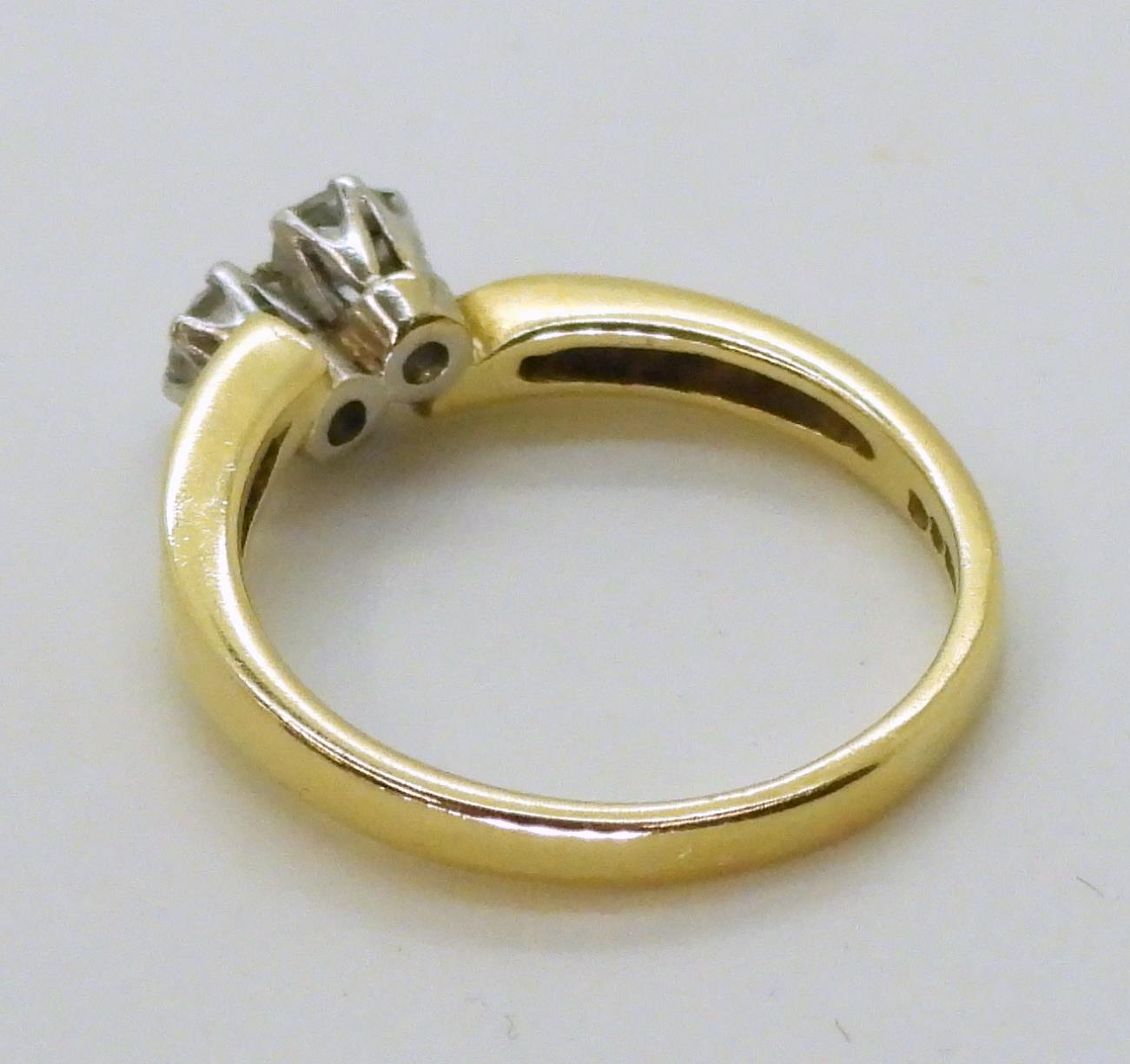 An 18ct gold twin stone diamond ring, set with estimated approx 0.30cts of brilliant cut diamonds, - Image 2 of 2