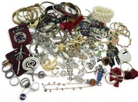 a collection of silver and costume jewellery to include silver bangles, an amber brooch, a silver