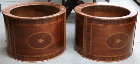 A pair of 20th century Holly Flowers mahogany planter covers, 37cm high x 54cm diameter (2)