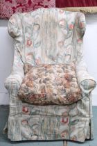 A late Victorian wing back armchair with floral cover on turned front supports, 117cm high x 77cm