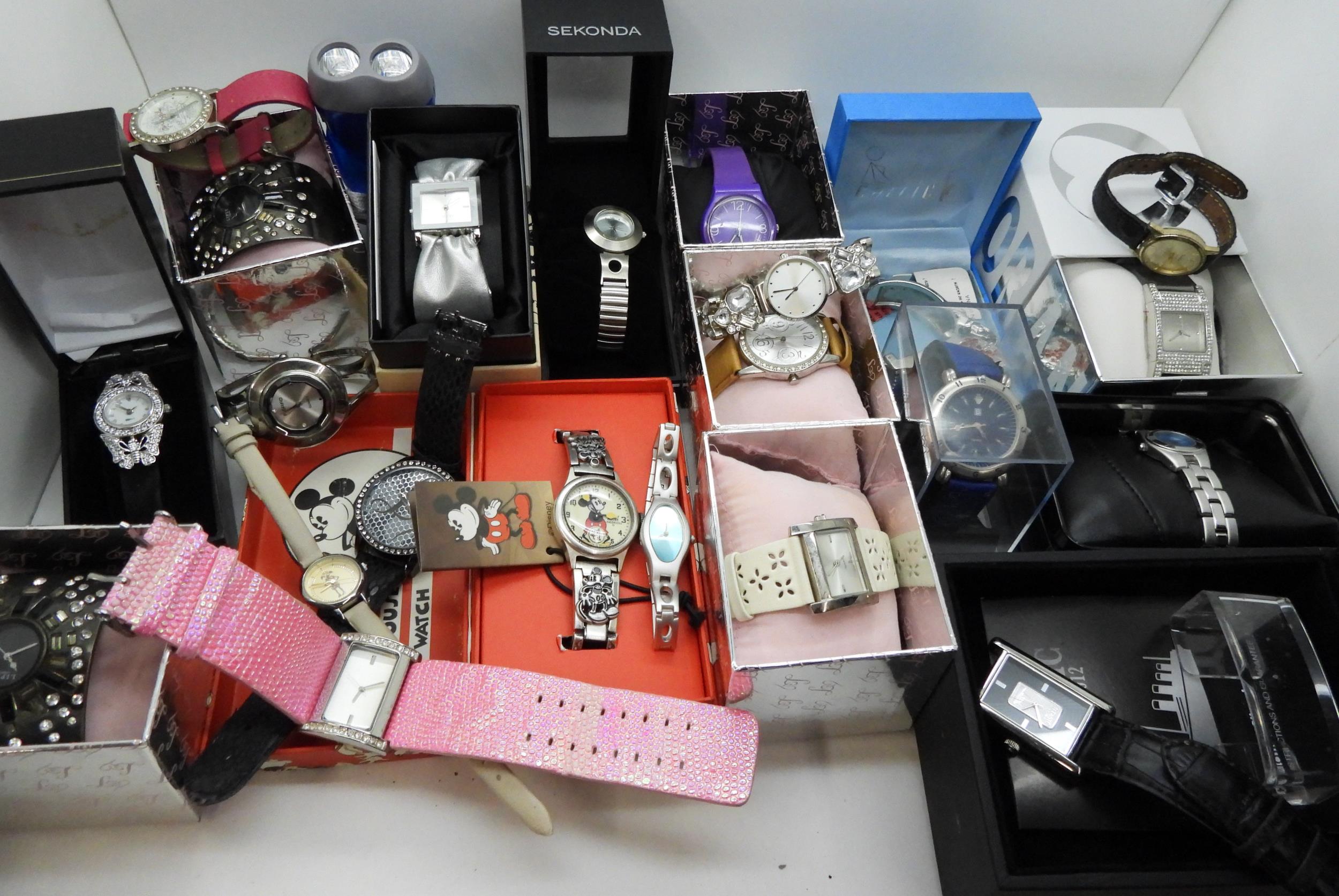 A large collection of ladies fashion watches, to include, a Danbury Mint Titanic Centenary silver