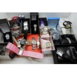 A large collection of ladies fashion watches, to include, a Danbury Mint Titanic Centenary silver