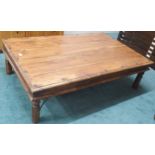 A late 20th century mango wood and metal bound coffee table, 40cm high x 145cm long x 92cm deep