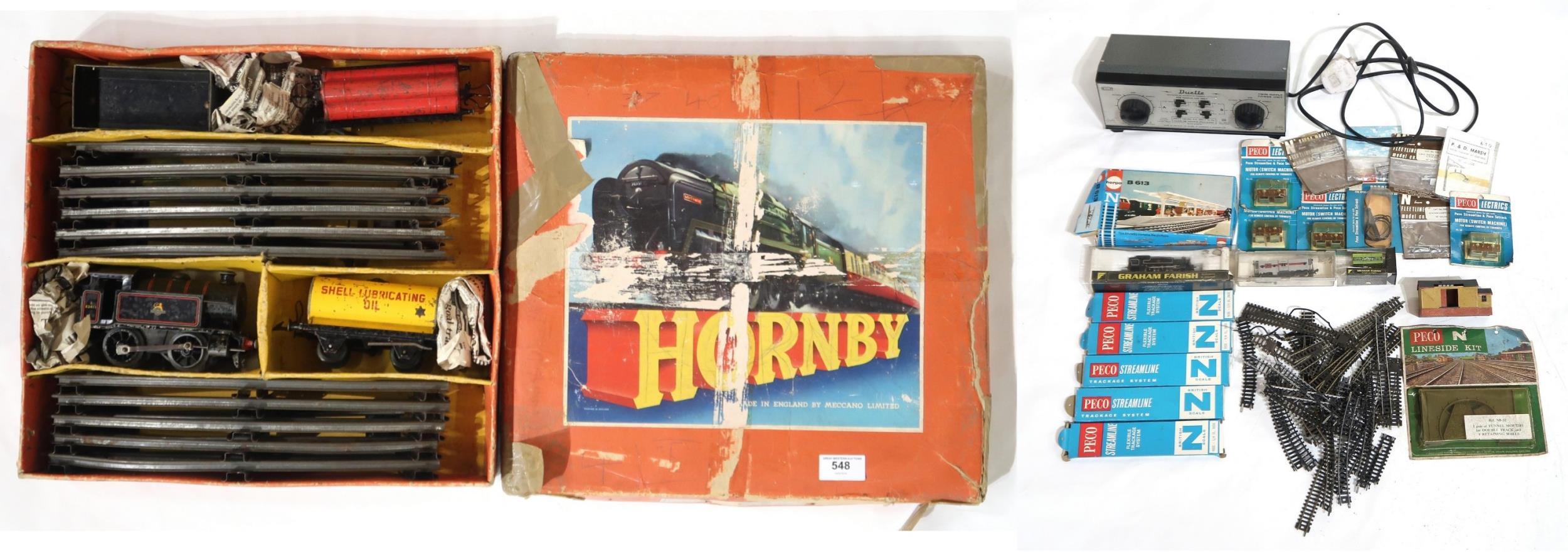 A boxed Hornby 0-gauge clockwork train set, together with a small assortment of N-gauge model