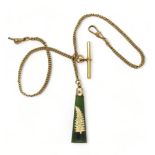A rolled gold double watch chain, with an attached yellow metal mounted New Zealand jade pendant