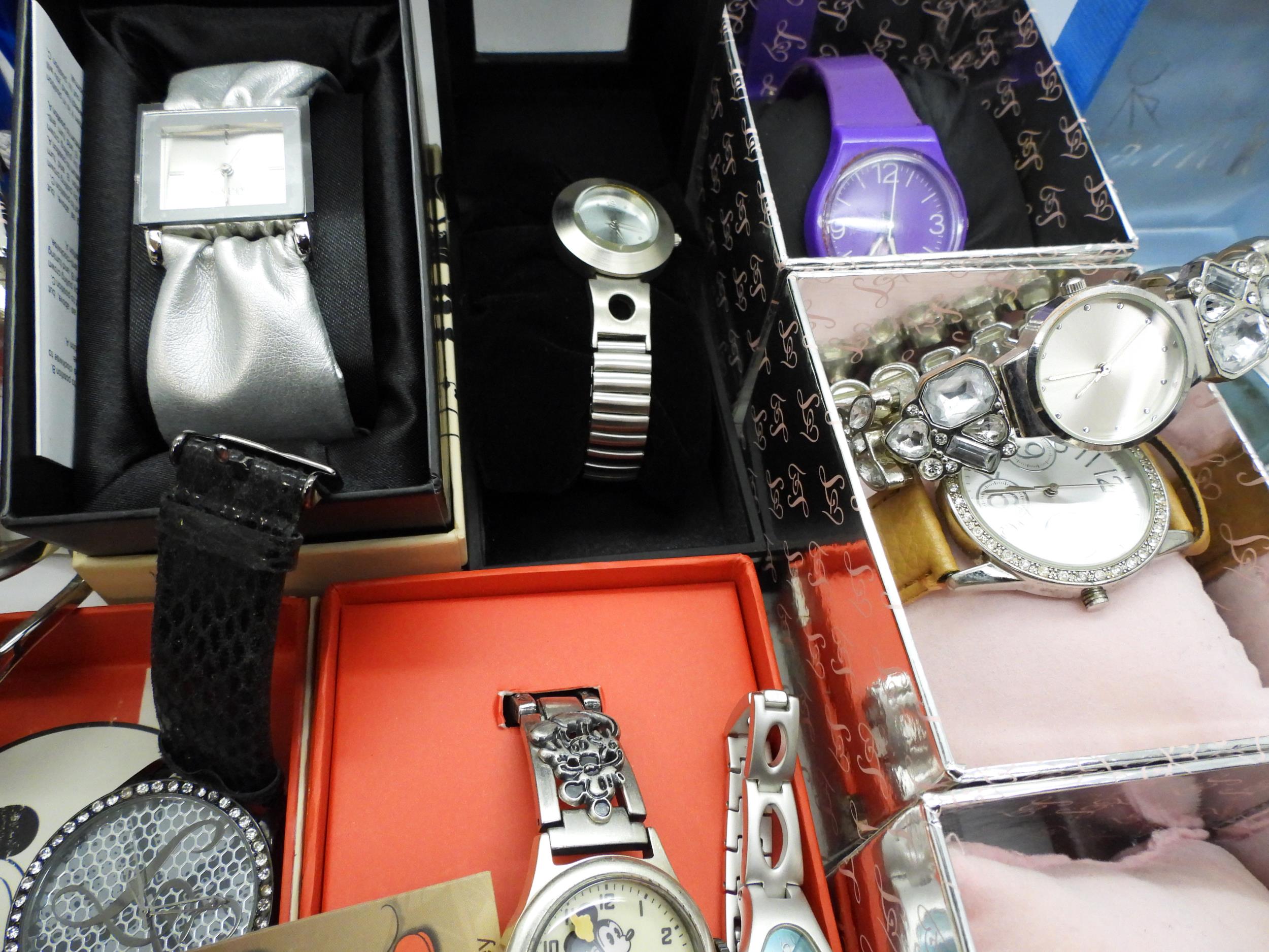 A large collection of ladies fashion watches, to include, a Danbury Mint Titanic Centenary silver - Image 3 of 4