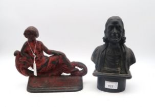 A cast iron bust of John Wesley together with a cast iron door stop modelled as a reclining woman