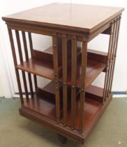 An Edwardian mahogany revolving bookcase, 87cm high x 50cm wide x 50cm deep Condition Report: