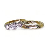 An 18ct gold ring set with three illusion set diamonds, with an approximate total of 0.30cts, finger