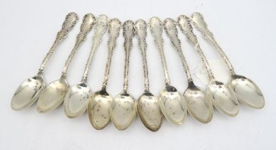 A set of Canadian silver teaspoons, by P.W Ellis & Co, with scrollwork borders, 312gms  (10)
