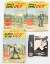 Three Gilbert James Bond 007 card-backed figures - No. 4 Odd Job with Dangerous Derby, No. 5 "M"