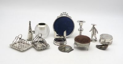 A collection of silver including a silver glass globular match striker, Birmingham, a pair of silver