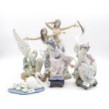 A group of Lladro porcelain including a pair of girls dancing, two Geishas, two Heron groups and a