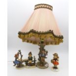 Three Hummel figures and a lamp Condition Report:Available upon request