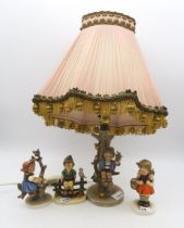 Three Hummel figures and a lamp Condition Report:Available upon request