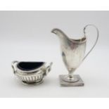 A George III silver cream jug, probably by Peter & Ann Bateman, London 1793, of helmet form, with