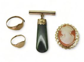 A 9ct gold mounted cameo brooch, a 9ct gold bar brooch with a New Zealand jade pendant, and two